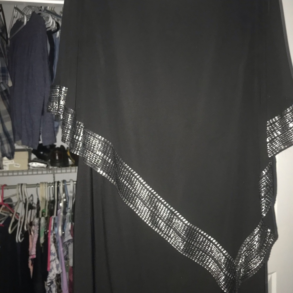 A symmetrical black dress